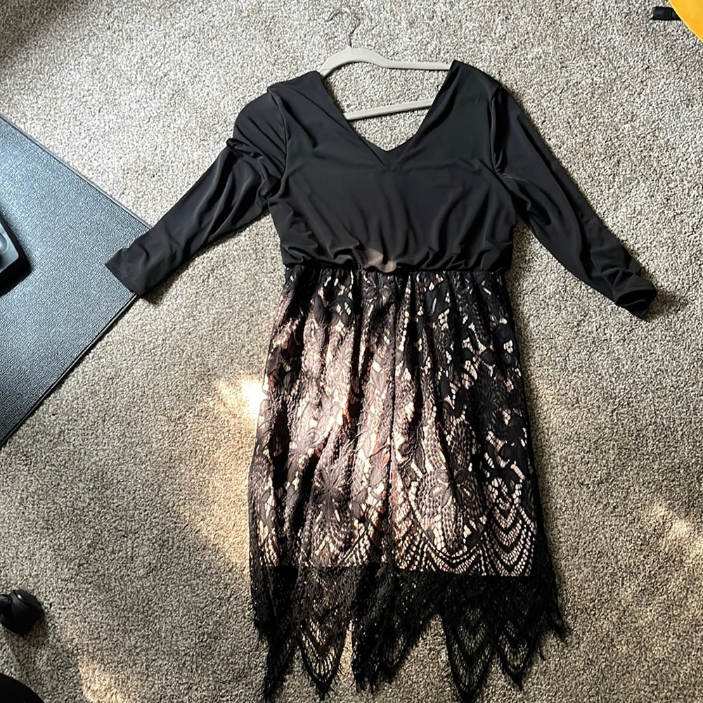 Black dress, lace on bottom with nude liner. Size large.